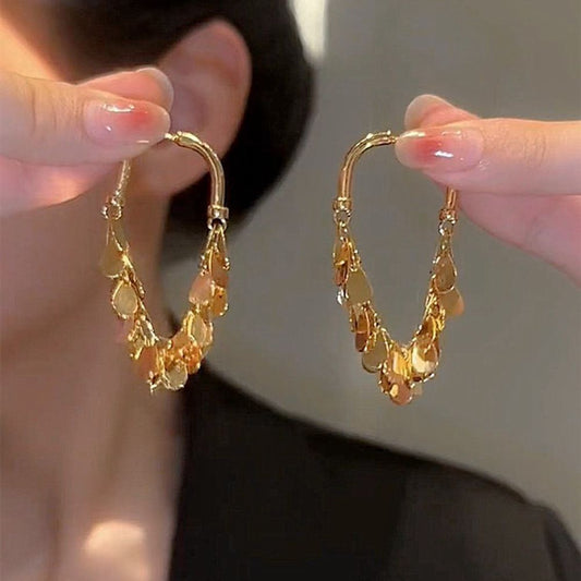 BOUCLES D’OREILLES À FRANGES ET PAILLETTES