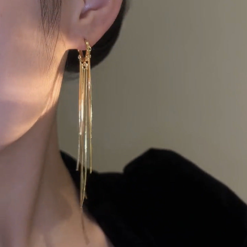 BOUCLES D’OREILLES À LONGUES FRANGES