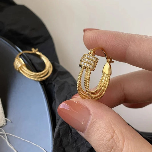 BOUCLES D’OREILLES À COUCHES GÉOMÉTRIQUES