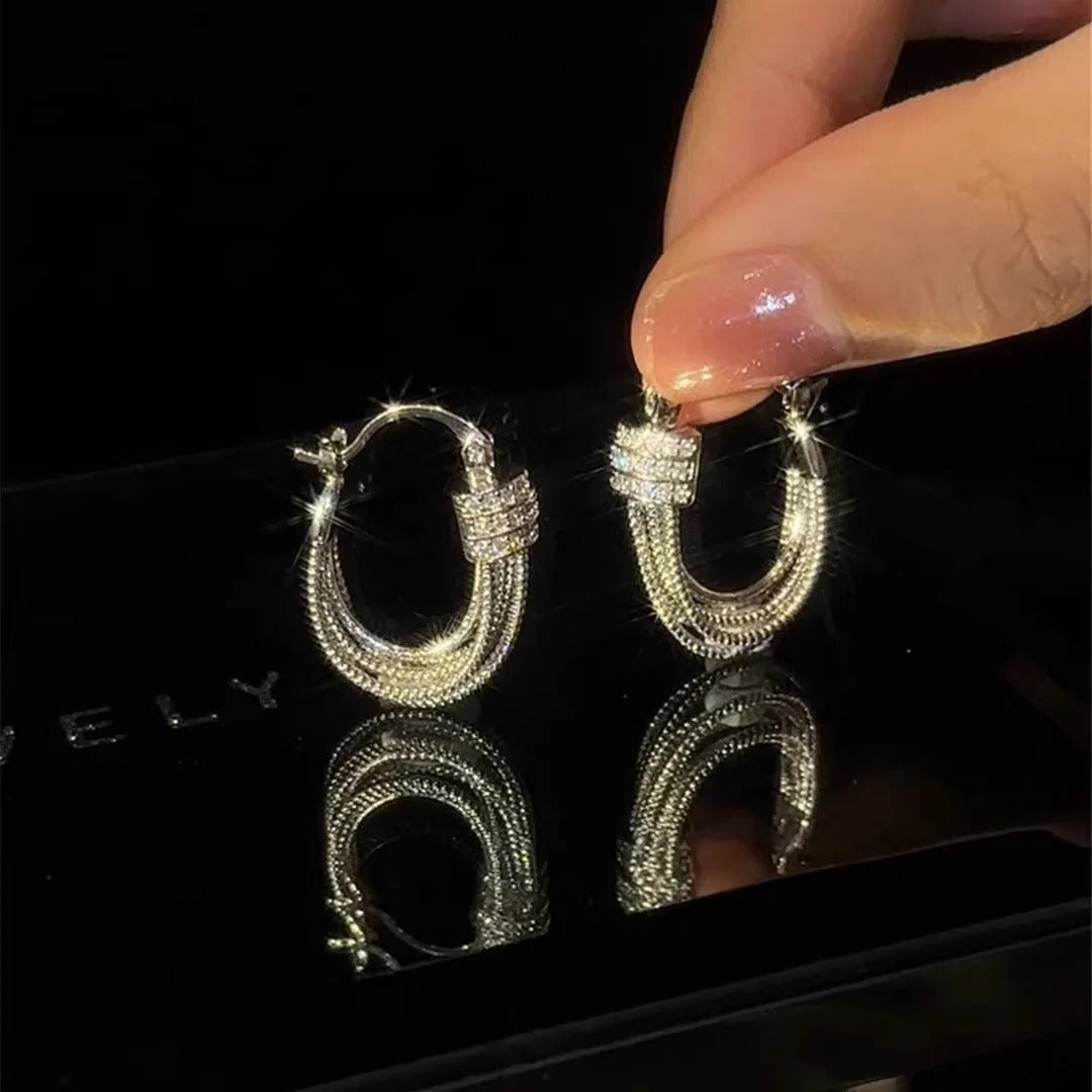 BOUCLES D’OREILLES À COUCHES GÉOMÉTRIQUES