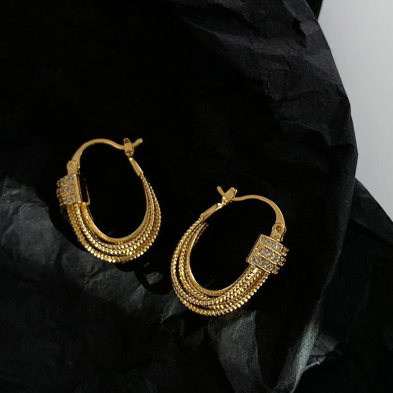BOUCLES D’OREILLES À COUCHES GÉOMÉTRIQUES